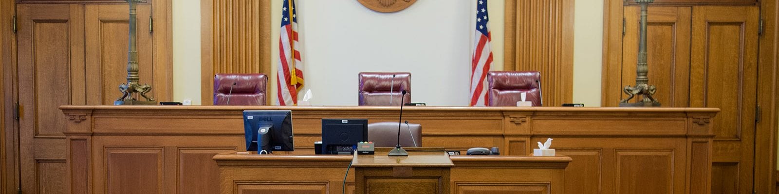 Empty judge's chair inside of a U.S. court room.