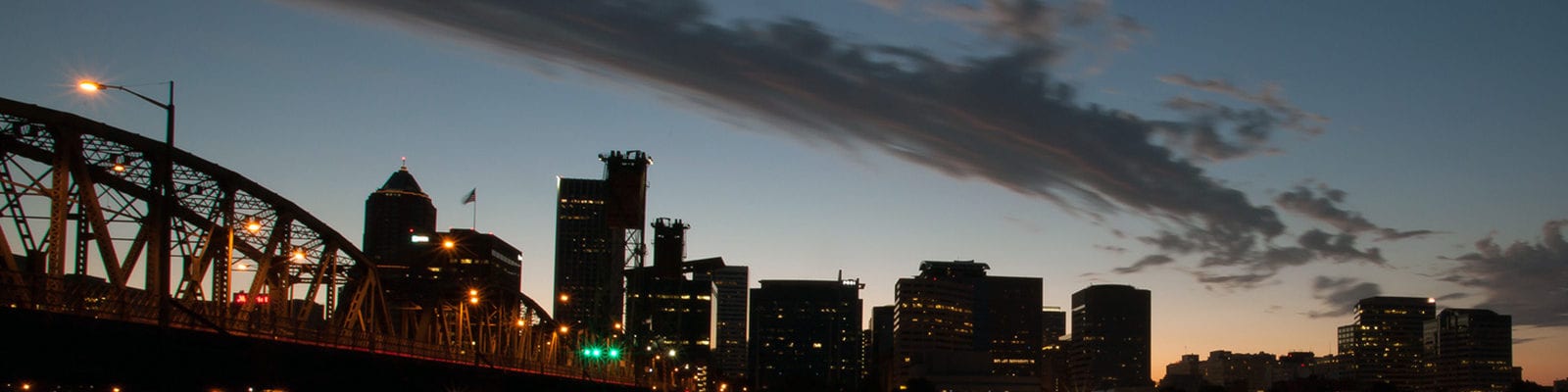 View of downtown Portland, Oregon and the Hawthorne bridge, from the east side of the Willamette River.