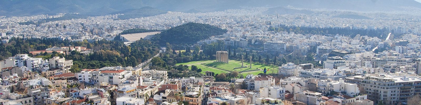 The Athens, Greece skyline, photographed on a clear, sunny day.